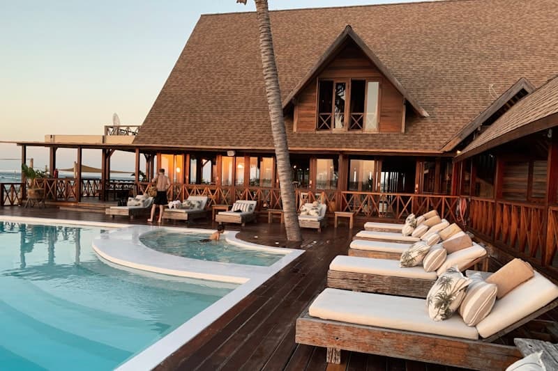 Poolside loungers at a seaside hotel at dusk