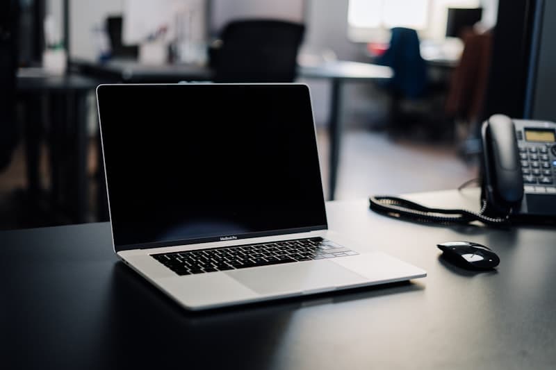 An open laptop ready for a call on a tidy office desk